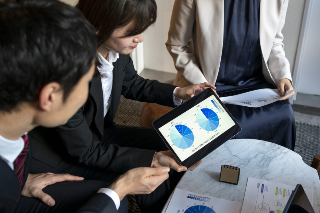 business people working with ipad side view